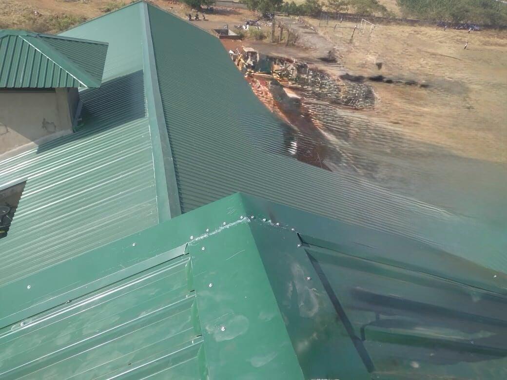 Architectural standing seam roofing for Lodha Mumbai: Premium metal building envelope featuring a minimalist aesthetic and hidden fastener technology by Rishonn & Reyansh.